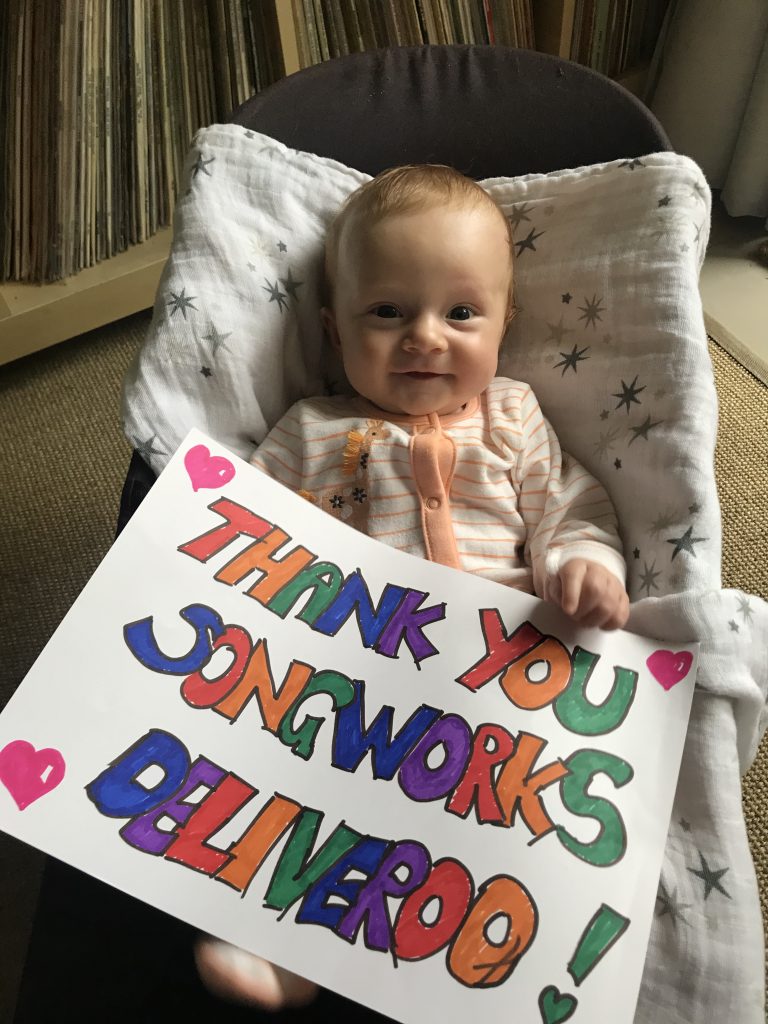 A photo of Florence holding a 'thank you' sign
